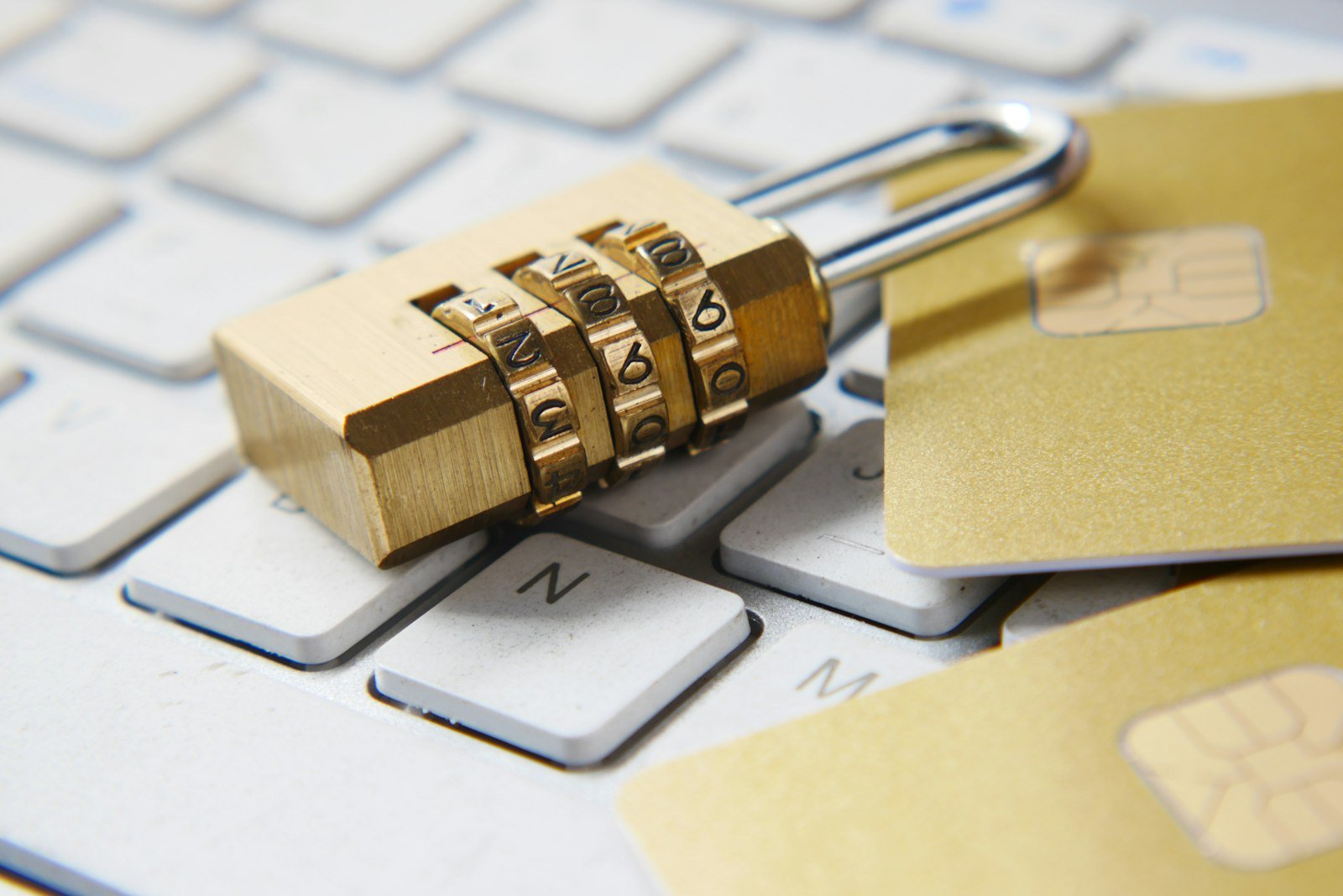 A padlock resting on a keyboard, symbolizing account security